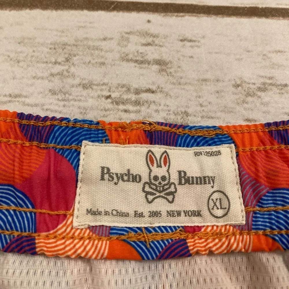 Psycho Bunny Orange Red Blue Geometric Swim Trunks